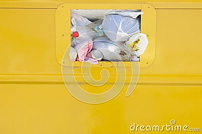 Yellow recycling container Stock Photo