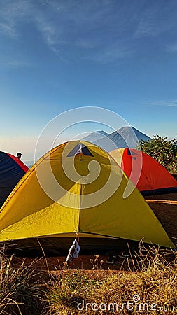 yellow and red camping tents in the Wonosobo boat mountainside area Editorial Stock Photo