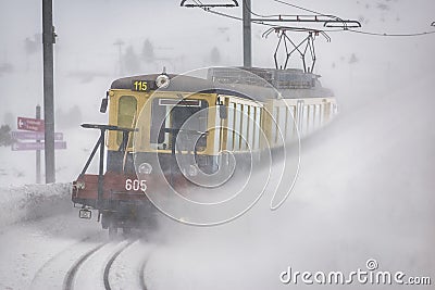 Yellow/Red train of Jungfrau Bahn at Kleine Scheidegg station Editorial Stock Photo