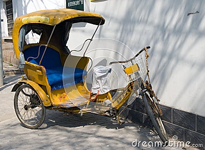 Yellow rickshaw Stock Photo