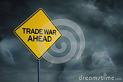 Yellow road sign with text of trade war ahead Stock Photo