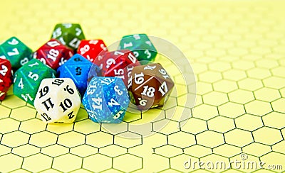 Yellow role-playing board with several colored dice Stock Photo