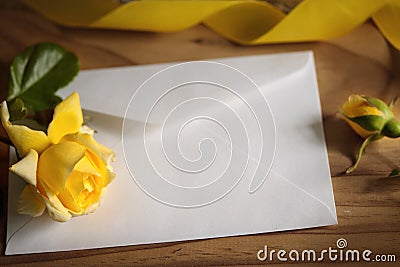 Yellow roses on wooden background Stock Photo