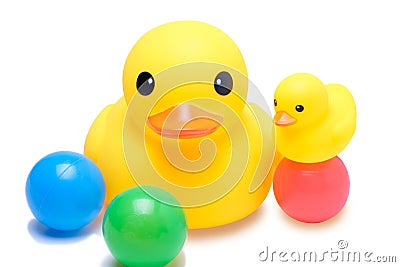 Yellow rubber duck with colorful ball Stock Photo