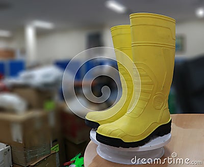 Yellow safety boots for workers, to protect their feet from work accidents Stock Photo