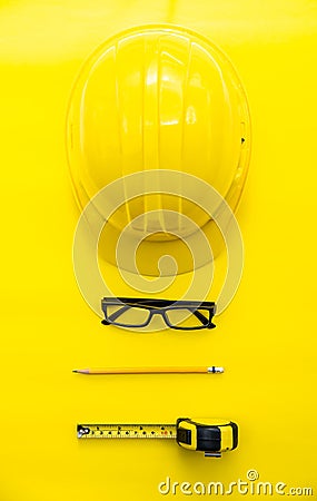 Yellow Safety Engineer and Cartridge, Pencil, glasses Put on yellow ground Stock Photo