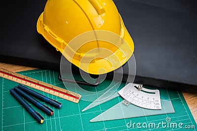 Yellow Safety Helmet Hat and Drawing Tools Stock Photo