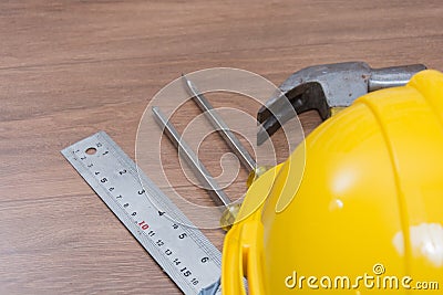 Yellow safety helmet and some tools Stock Photo