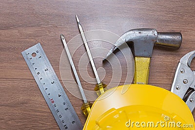 Yellow safety helmet and some tools Stock Photo
