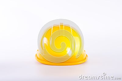 Yellow safety helmet on white background. Hard hat isolated on white. Safety equipment concept. Worker and Industrial theme Stock Photo