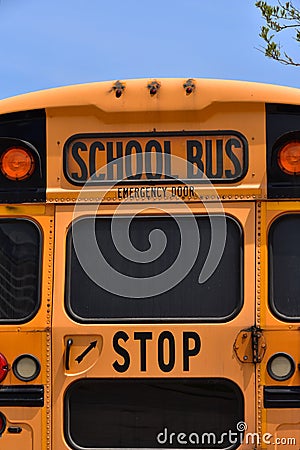 Yellow School Bus Emergency Door at rear of Bus. Stock Photo