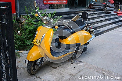 Yellow scooter Editorial Stock Photo