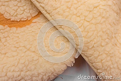 Yellow sheep material wool fur soft structure fleece fabric background texture warm natural nature skin Stock Photo