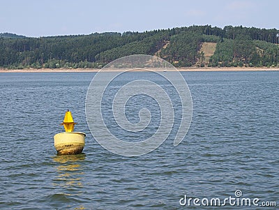 Yellow ship buoy floating Stock Photo