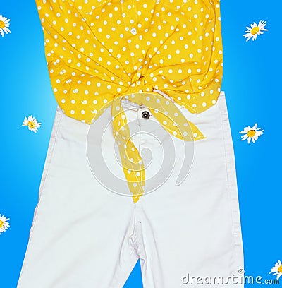 Yellow shirt with knot and white jeans Stock Photo