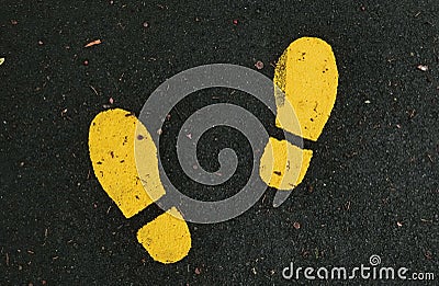 Yellow Shoe Prints Stock Photo