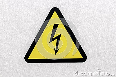 Yellow sigh danger electric shock with lightning in triangle on a metal door. Danger Electrical Hazard High Voltage Sign Stock Photo