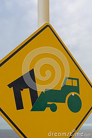 Yellow sign with bulldozer demolishing house, Memory Park Stock Photo