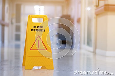 yellow sign of caution reserve cleaning on wet floor Stock Photo