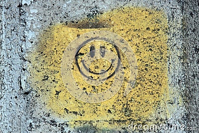 Yellow smile on the grunge wall Stock Photo