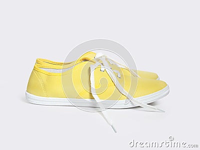 Yellow sneakers isolated on white background Stock Photo