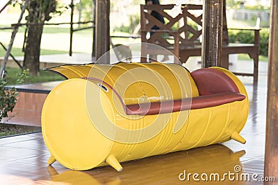 Yellow Sofa made of Recycled Oil Drums Stock Photo