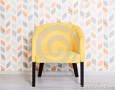 Yellow soft armchair in a room Stock Photo