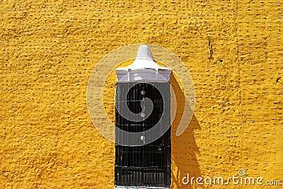 Yellow spanish colonial style wall in Valladolid Stock Photo