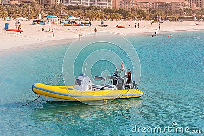 Yellow speedboat waits tourists for tours and excursions around the Persian Gulf in Dubai. Transportation and active Editorial Stock Photo