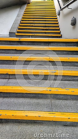 Yellow steps near local train station Stock Photo