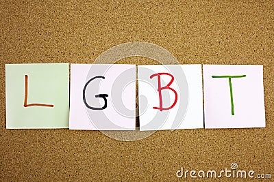 A yellow sticky note post it writing, caption, inscription LGTB Lesbian, gay, bisexual and transgender acronym in black ext on a s Stock Photo