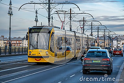 A yellow streetcar on Margaret Bridge Editorial Stock Photo