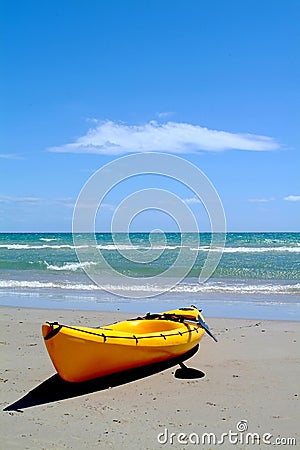 Yellow surf rescue canoe Stock Photo