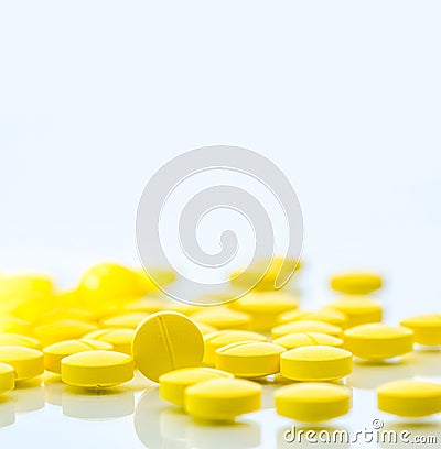 Yellow tablets pills isolated on white background Stock Photo