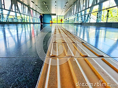 Yellow tactile paving for blind peoples pathway. Stock Photo