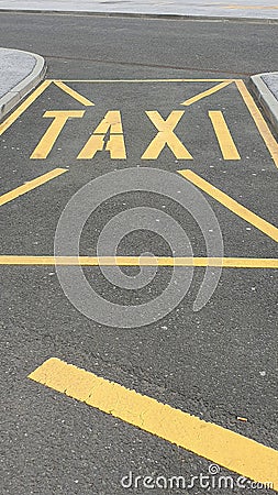 Yellow Taxi parking sign on a street Stock Photo