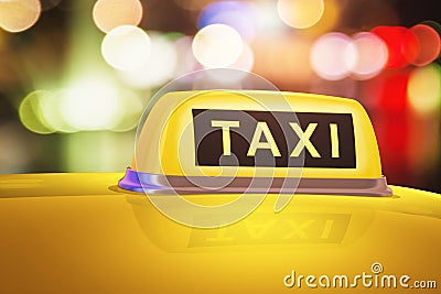 Yellow taxi sign on car Stock Photo