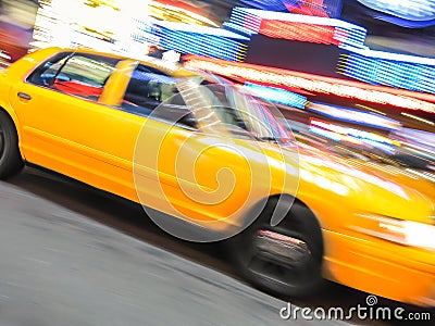 Yellow taxi speeding near Times Square in New York. Stock Photo