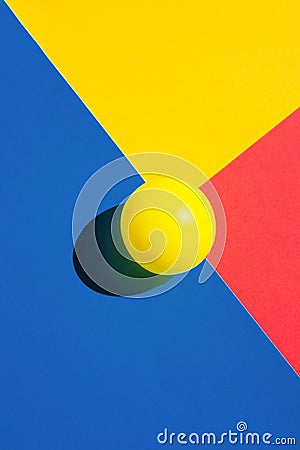 Yellow tennis ball on blue red polygon shape elements. Abstract colorful graphic geometric composition. Business innovation Stock Photo
