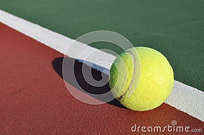 Yellow Tennis Ball on Court Stock Photo