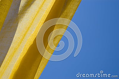 Yellow tent and blue sky Stock Photo