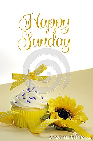 Yellow theme cupcake and sunflower with Happy Sunday Stock Photo