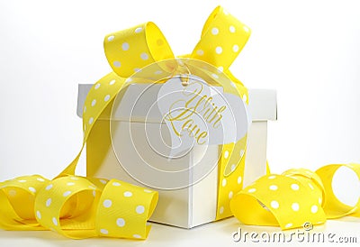 Yellow theme gift box with yellow polka dot ribbon Stock Photo