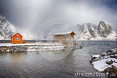 Yellow Traditional Rorbu House in Sakrisoy Fishing Village Stock Photo