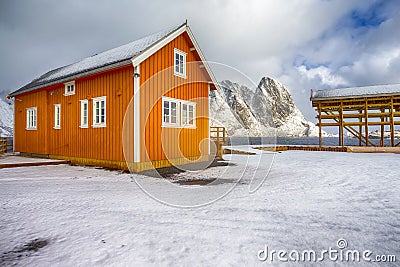 Yellow Traditional Rorbu House in Sakrisoy Fishing Village Stock Photo