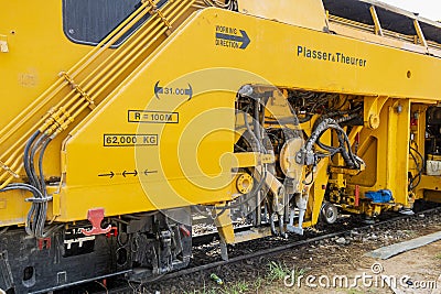 The yellow train Plasser theurer Editorial Stock Photo