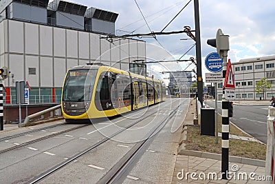 Yellow tram street car of U-OV in Utrecht as part of the Uithoflijn, contruction project with huge cost overrun Editorial Stock Photo