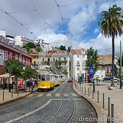 Yellow trams on a Lisbon street Editorial Stock Photo