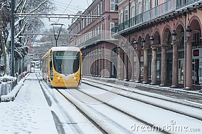 Yellow Tramway rolling in the snowy streets Editorial Stock Photo