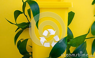 Yellow Trash Can With Recyclable Symbol Stock Photo